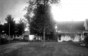 Carriage Wagon Parked Between Two Houses