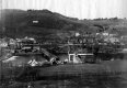 View of Mill Set on River with Covered Bridge