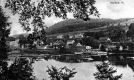 View of Mills and Houses From Across the River