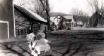 Girl and Young Baby in Town