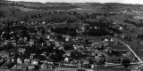 Bird's eye view of town and open fields