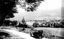 A car beside valley fields