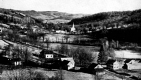 Bird's eye view of village and open fields