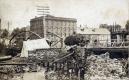Hay wagon crossing Main Street bridge after Sweat Comings fire