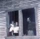 Family in window of Old Hotel on Snake Mountain