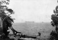 Canoeists Viewing Islands in Lake Champlain from Shore