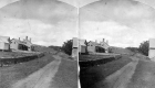 Dirt Road Passing by a Farmhouse
