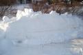 Imprint of car in snowbank