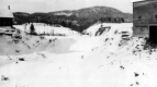 Snow covered riverbed with eroded banks