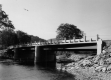Bridge with Rocky Shoreline and Power Lines