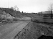 Dirt Road with Wooden Fences and Erosion