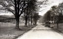 View of Dirt Road, Car and Fields