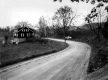 Bend in a Dirt Road and House