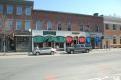 Stores lining Main Street with brightly colored awnings
