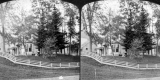 House with People Out Front and Wooden Fence