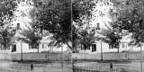House on Street with Picket Fences