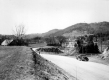 Dirt Road Around a Corner with Wooden Guard Fence