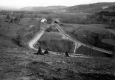 Straightened Paved Road with Farm and Pastures