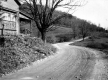 Dirt Road and House with Stone Foundation