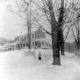 Woman in front of a House in Winter
