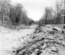 Dirt Road Under Construction with Boulders as Banks