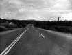 Three Lane Paved Road and House