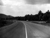 Car Parked Beside Newly Paved Road