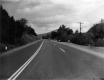 Freshly Paved Three-Lane Road Looking East