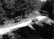 Truck on Dirt Road with Wooden Guard Fences and culvert