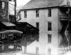 Car and Buildings Submerged in Water