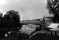 Covered bridge by church