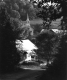 Church and House Along a Dirt Road