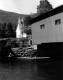 Fly Fisherman Near a Covered Bridge