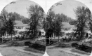 Horse and Carriage in Front of a House