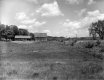 House and Barn in Open Field