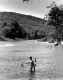 Fisherwoman in River