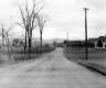 House and Barn Along Road