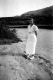 Woman in White Near Lake
