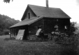 House in Field with Buggy