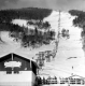 Skiers Waiting in Line at the Spruce Peak Double Chair Lift