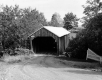Wooden Covered Bridge and Dirt Road