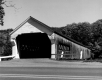Covered Bridge with Paved Road in Foreground