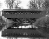 Covered Bridge Over a Calm River