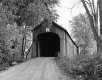 Dirt Road Approaching a Covered Bridge