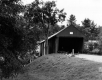 Dogs in Front of a Covered Bridge