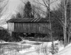 Covered Bridge Over Icy River