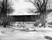 Covered Bridge with Frozen Dam in Background