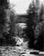 High Covered Bridge with Water Fall Below