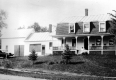 Woman and Man Sitting on Porch