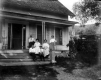 Family Sitting on Front Porch